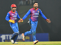 Afghanistan's Rashid Khan celebrates after taking the wicket of Sri Lanka during the final one-day international cricket match between Sri L...