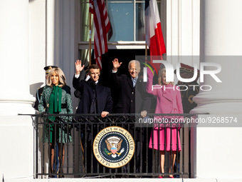 President Emmanuel Macron and Mrs. Brigitte Macron of France and President Joe Biden and Dr. Jill Biden wave from a balcony at the White Hou...