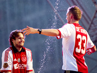 Ajax captured their fourth successive Dutch League title, and 33rd overall, with a 1-1 draw at Heracles Almelo. (