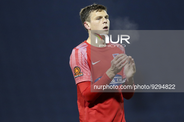 Matthew Robinson of Dagenham & Redbridge thanks the travelling supporters during the FA Cup ''nd round replay between Gillingham and Dagenha...