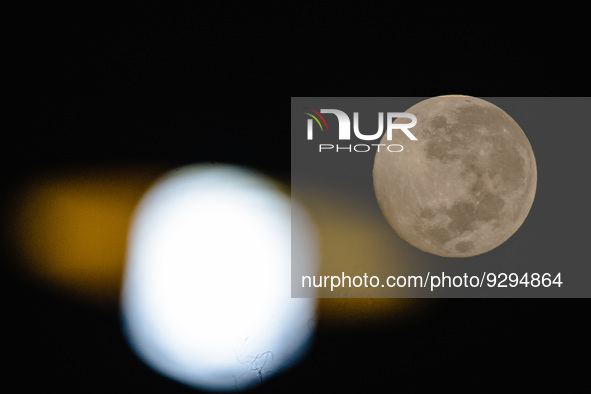Full cold moon is seen over Ungaran, Central Java Province, Indonesia, on the early morning of December 9, 2022. 