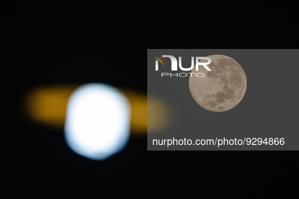 Full cold moon is seen over Ungaran, Central Java Province, Indonesia, on the early morning of December 9, 2022. 