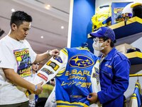 Ismail Ashlan, Marketing Communications Manager, Subaru Indonesia (L) explain the varsity subaru exclusive collection during the Urban Sneak...