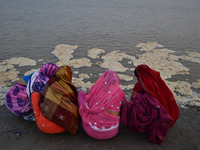  Indian women worship in  polluted river bank of River Ganges, in Allahabad on November 27,2015. Over 500 million citizens depend on the Riv...