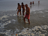 Indian hindu devotees take a holy dip in polluted water of River Ganges,in Allahabad on November 27,2015.Over 500 million citizens depend on...