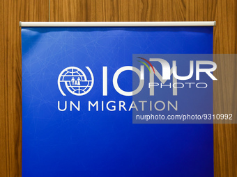 International Organization for Migration logo is seen during the job fair, organized mainly for Ukrainian refugees, in Krakow, Poland on Dec...