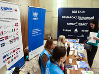 People are seen during the job fair, organized mainly for Ukrainian refugees, in Krakow, Poland on December 8, 2022. (