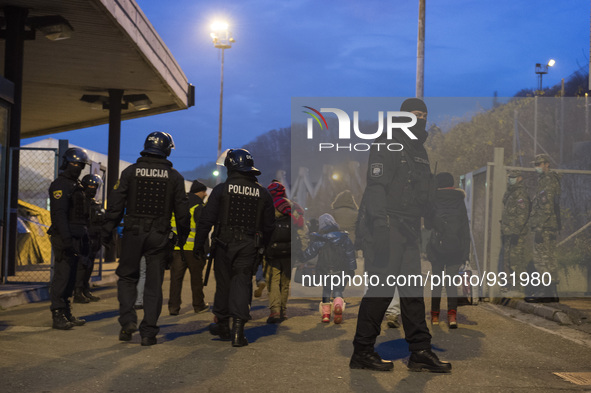 Migrants wait to be allowed to cross to Austria, in Sentilj, Slovenia. About 5,000 migrants are reaching Europe each day along the so-called...