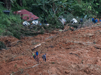 Malaysia authorities inspected the location after a landslide hit the campsite in Batang Kali, state of Selangor, Malaysia, on December 16,...