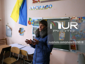 The village elder Iryna Borzak speaks at a school damaged during hostilities is seen at the Rudnytske village in the Kyiv region, Ukraine 13...