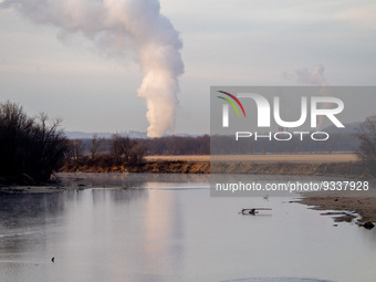 Pollution from power stations near Lawrenceburg, Indiana are seen near the Great Miami River on Monday, December 19, 2022, in North Bend, Oh...