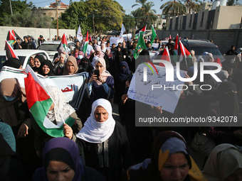 Palestinians take part in a protest in front of the United Nations Educational, Scientific and Cultural Organization (UNESCO) headquarters i...