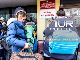 Ukrainians queue at the railway station in Przemysl, Poland  to depart for Ukraine on December 20, 2022. Since the beginning of the Russian...