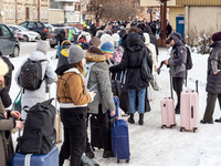 Ukrainians queue at the railway station in Przemysl, Poland  to depart for Ukraine on December 20, 2022. Since the beginning of the Russian...