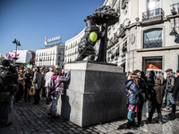 Statue of the Bear and the Strawberry Tree with balloon of the COP21 during the march in Madrid on 29 november, 2015 (