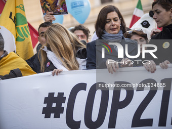Italy's President of the Chamber of Deputies Laura Boldrini (L) and Environmental association Legambiente activist Rossella Moroni (R), marc...