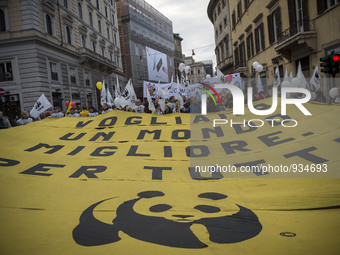 Demonstrators march during a rally calling for action on climate change on November 29, 2015 in Rome a day before the launch of the COP21 co...