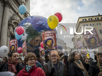 Demonstrators march during a rally calling for action on climate change on November 29, 2015 in Rome a day before the launch of the COP21 co...