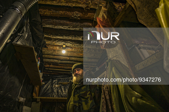 An ukrainian soldier waits in the underground base of his unit during a russian shelling in the Zaporizhia region. 