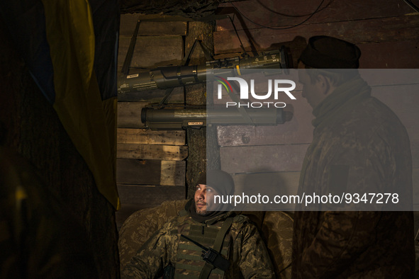An ukrainian soldier talks with his fellows in  his underground base after returning from the frontlines in Zaporizhia region. 