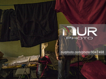 A displaced man from the russian occupied city of Orihiv in his refugees shelter in Zaporizhia, Ukraine. Many people moved out of the russia...