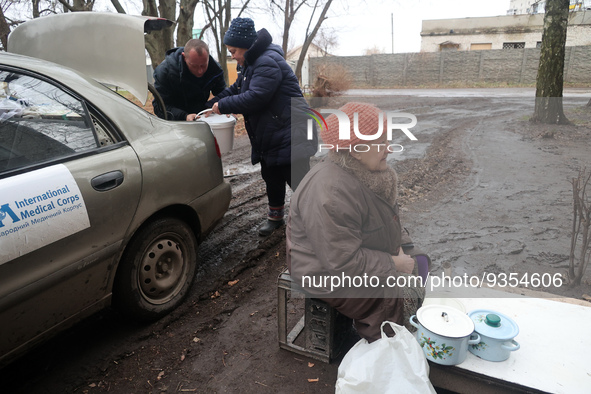 KHARKIV REGION, UKRAINE - DECEMBER 22, 2022 - Residents of the city of Izium liberated from the Russian occupiers receive hot food from volu...