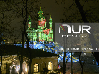 People look at the St Andrew church illuminated by the world-famous Swiss light artist Gerry Hofstetter Before Christmas in Kyiv, Ukraine, 2...