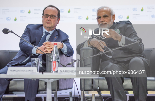 India's Prime Minister Narendra Modi (R) and French President Francois Hollande (L) during the Heads of State media event on carbon pricing,...