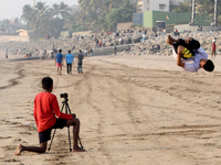 A boy shoots a video of his stunt near a sea beach in Mumbai, India, 04 January, 2023. Smartphone flattens internet growth curve in India ac...