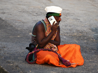 A man talks on a mobile phone near a sea beach in Mumbai, India, 04 January, 2023. Smartphone flattens internet growth curve in India accord...