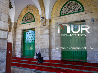 A Muslim woman prays at the Al-Aqsa Mosque in the Temple Mount  in Jerusalem, Israel on December 29, 2022. (