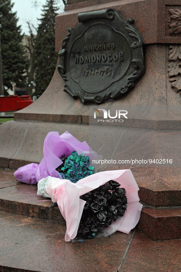 DNIPRO, UKRAINE - JANUARY 6, 2023 - Flowers are seen at the empty pedestal after dismantling the monument to a russian scientist Mikhail Lom...