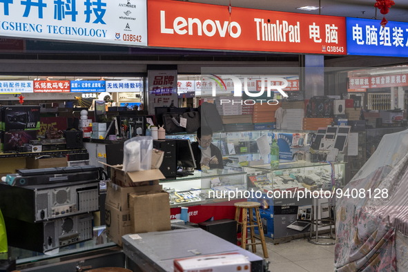 A shop Keeper at a shop inside a shopping center at Huaqiangbei, a popular place to buy electronic goods on January 8, 2023 in Shenzhen, Chi...