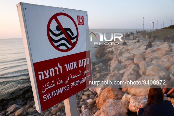 'Swimming prohibited' sign is seen on Charles Clore Beach at the Mediterranean Sea in Tel Aviv, Israel on December 30, 2022. 