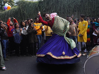 A participant dances as others cheer during the annual Delhi Queer Pride March, an event promoting lesbian, gay, bisexual and transgender ri...