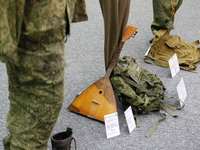 Combat equipments of Russian soldiers are seen during a media briefing of the Security and Defense Forces of Ukraine in Kyiv, Ukraine on 12...