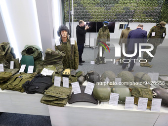 Journalists look at combat equipments of Russian soldiers during a media briefing of the Security and Defense Forces of Ukraine in Kyiv, Ukr...