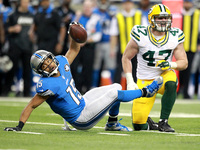 Detroit Lions wide receiver Golden Tate (15) gets tackled by Green Bay Packers outside linebacker Jake Ryan (47) during the second half of a...