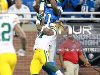 Detroit Lions wide receiver Calvin Johnson (81) catches a pass defended by Green Bay Packers cornerback Sam Shields (37) during the first ha...