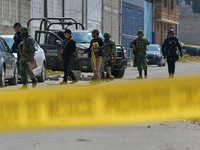 Forensic experts of the State of Mexico carry out the diligences where were found in a clandestine grave inside an industrial warehouse at l...