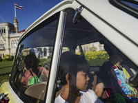 Children play a car model during the Children's Day celebration at Government House in Bangkok, Thailand, January 14, 2023. Children’s Day i...