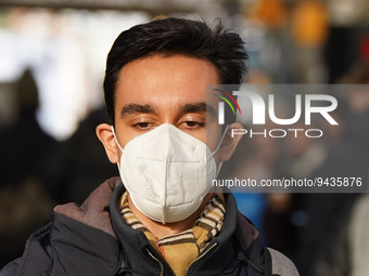 A man wears a face mask at Cologne central station on 14 January 2023. (