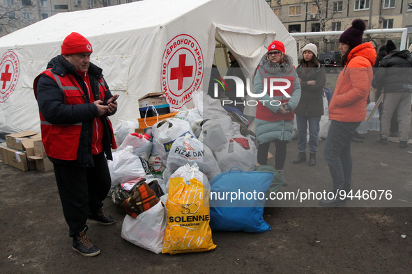 DNIPRO, UKRAINE - JANUARY 15, 2023 - A Ukrainian Red Cross Society tent is situated outside an apartment block hit by a rocket launched by R...