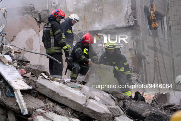 DNIPRO, UKRAINE - JANUARY 15, 2023 - Rescuers remove the rubble and search for people at an apartment block hit by a rocket launched by Russ...