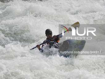 PUSKAR KADEL, 21yrs, A Professional kayaker showing skills and following rafting boat at Trishuli River, 85Km from the capital Kathmandu, Ne...