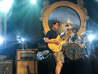 Ezra Koenig (L)) and Chris Tomson of the band Vampire Weekend perform in concert at Stubb's on April 25, 2014 in Austin, Texas. (