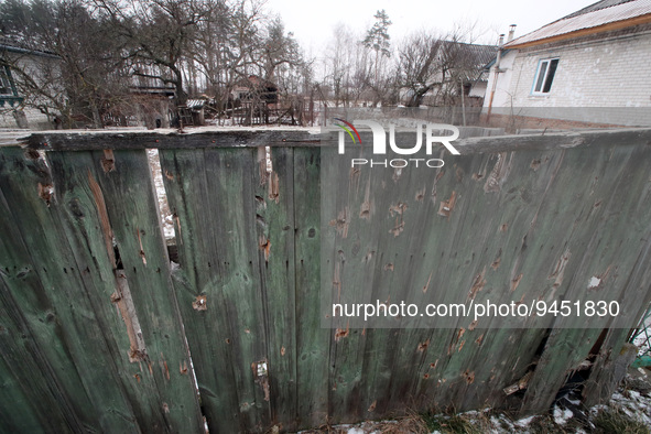 YAHIDNE, UKRAINE - JANUARY 14, 2023 - Bullet holes dot a wooden fence, Yahidne village, Chernihiv Region, northern Ukraine. During the Russi...