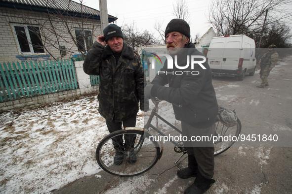 YAHIDNE, UKRAINE - JANUARY 14, 2023 - Two local residents are pictured on a street in Yahidne village, Chernihiv Region, northern Ukraine. D...