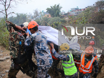 Nepalese army along with the police personnel recover the bodies from the wreckage of domestic Yeti Airlines that crashed with 72 people on...