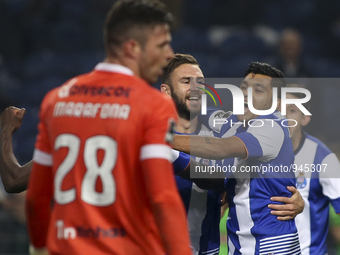 Porto's Mexican defender Miguel Layún (C) celebrates after scoring goal with teammate Porto's Mexican forward Jesús Corona during the Premie...